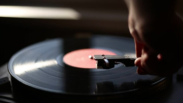 Playing classic vinyl records in daylight close-up