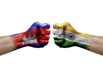 Two hands punch to each others on white background. Country flags painted fists, conflict crisis concept between cambodia and india