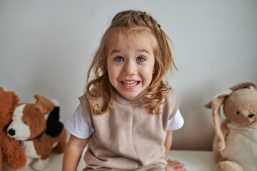 a little girl with toys