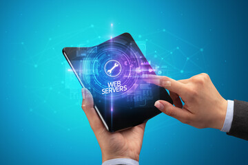 Businessman holding a foldable smartphone, technology concept