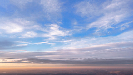 Fototapeta na wymiar Sky with white clouds after sunset. Sky