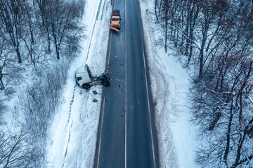 Truck accident, aerial view in winter, road icing in winter, drone view