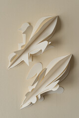 two isolated decorative finial shapes on paper