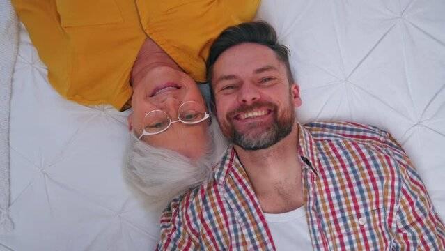 Generational Difference Between Grinning Elderly Grandma And Her Content Middle-aged Son. High Quality 4k Footage