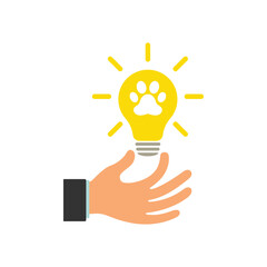 Animal paw icon on light bulb icon. Glowing light bulb in a businessman's hand. Illustration.