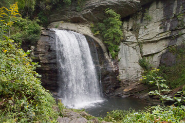 Fototapeta na wymiar Scenic Waterfall Cascades Over Rock at Looking Glass Falls