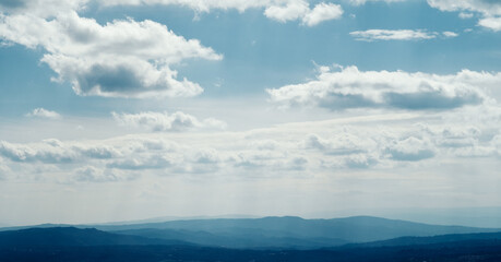 Naklejka premium clouds over the mountains