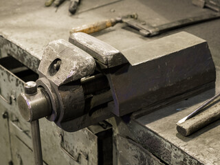 Large metal vice with worn jaws.