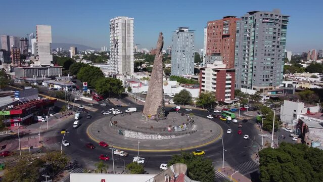 alt wide flying counter clockwise around Monumento a los Ninos Heroes in Guadalajara