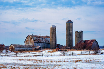 Rural landscapes of farms and barns and wooded area in the southern Ontario region of Canada.  Featuring outbuildings, and forested trails with brilliant skies.