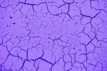 Cracked and damaged painted surface of a building or wall. Texture, aged paint background