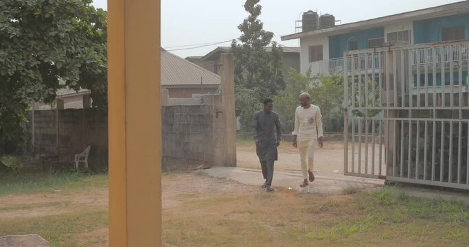Two young men walking into church