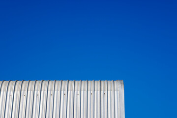 Metal sheet roof and blue sky on sunny day , can be used as a background