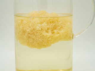 A Tremella placed in a glass water bottle waiting for soaked