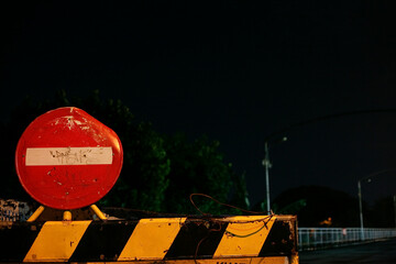 Road Closed sign and baricade at night