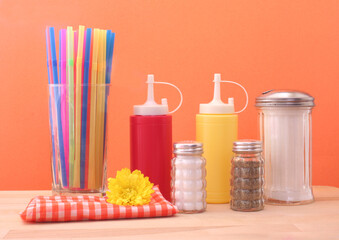 Ketchup, Mustard and Sugar on Blue Textured Background Diner or Kitchen