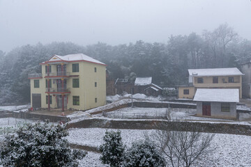 Fototapeta na wymiar Winter rural houses and snow scene