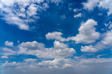 Blue sky background with many cumulus clouds