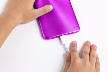 Child holding cellphone over white background