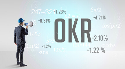 Engineer in hard hat with abbreviation