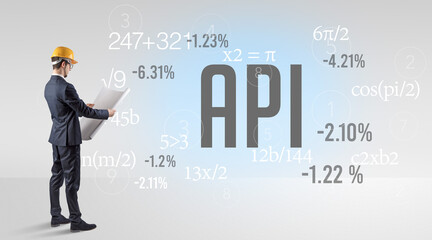 Engineer in hard hat with abbreviation