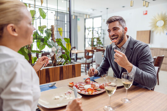 Couple eating lunch at a fancy restaurant.