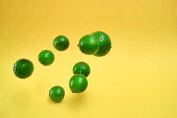 A lot of lemons falling, with yellow background.