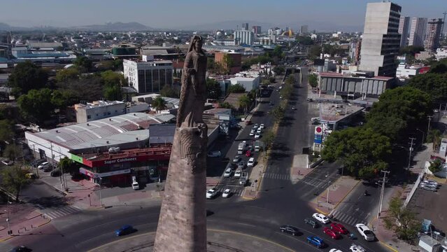 high angle flying clockwise around Monumento a los Ninos Heroes in Guadalajara