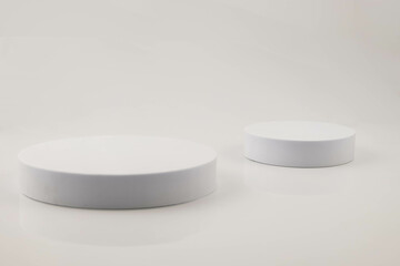 White background with white pallet props and green pine leaves. Background product. texture background Ideal backdrop for product presentations, exhibitions and mockups.