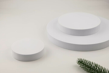 White background with white pallet props and green pine leaves. Background product. texture background Ideal backdrop for product presentations, exhibitions and mockups.