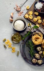 Italian pasta assortment on light background.