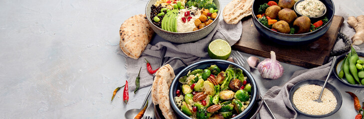Vegan dishes assortment on light background.