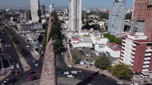 high angle flying counter clockwise around Monumento a los Ninos Heroes in Guadalajara