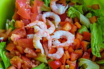fresh summer salad of lettuce, tomato, cucumber and shrimps
