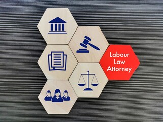 Labour law attorney concept with icons on wooden hexagon.