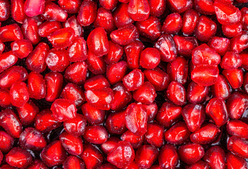 Ripe pomegranate fruits on the wooden background