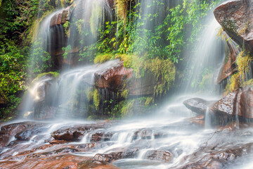 waterfall in deep rainforest during rainy season at Bueng Kan, Thailand.