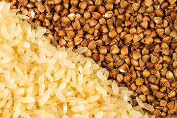 Grains of rice and buckwheat. The texture of the cereal is close-up.