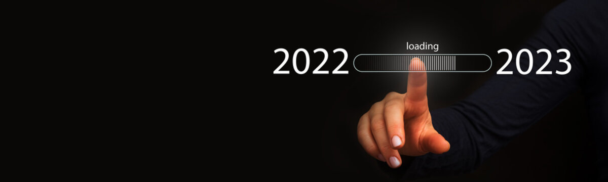 Finger pointing to loading to complete the year