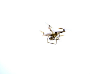 Close-up of drone is flaying against isolate white background