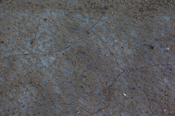 Texture of the dried earth. Dark brown background with cracks and hollows. Drought and lack of...