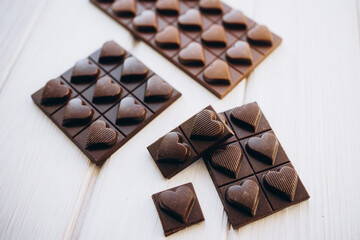 craft homemade milk and dark chocolate on a white wooden background