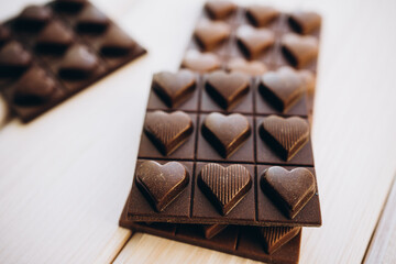 craft homemade milk and dark chocolate on a white wooden background
