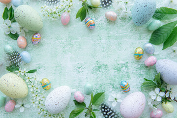 Fototapeta na wymiar Colorful Easter eggs on green wooden background
