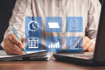 Businesswoman using a tax form to complete individual income tax payment form