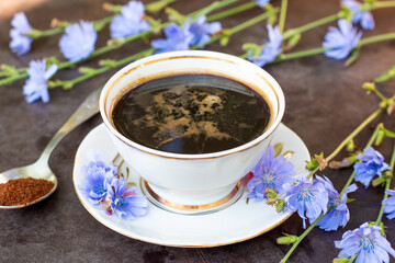 Healthy chicory drink in cup decorated chicory flowers.Herbal beverage, coffee substitute. - obrazy, fototapety, plakaty
