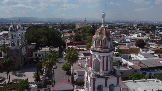 flying counter clockwise around bell tower in Tlaquepaque Guadalajara