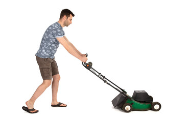 Man pushing old green lawn mower