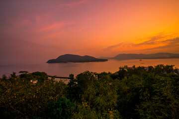 The background of the sea by the evening sea, with natural beauty (sea water, rocks, sky) and fishermen are fishing by the river bank, is a pleasure during travel.