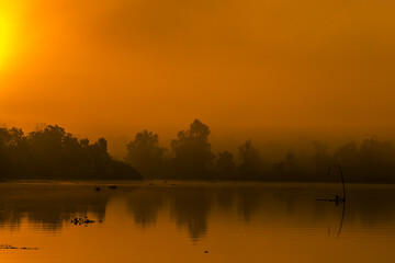 The background of the sea by the evening sea, with natural beauty (sea water, rocks, sky) and fishermen are fishing by the river bank, is a pleasure during travel.